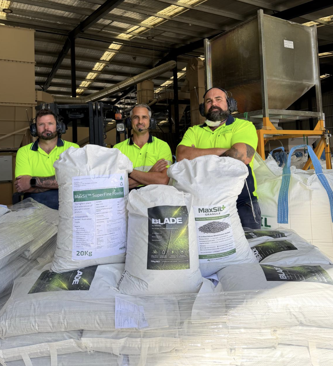 MaxSil team with packaged agricultural products at the production facility